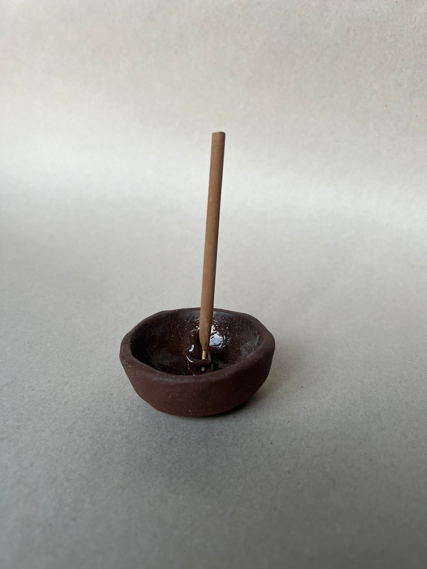 seated incense dish